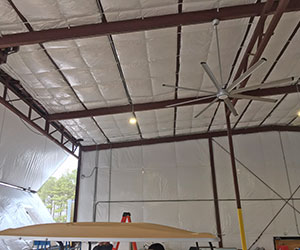 Interior of insulated airplane hangar.