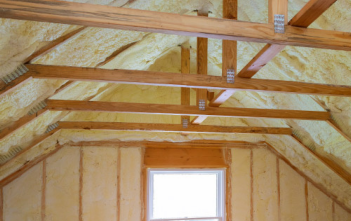 Exposed attic with framing and spray foam insulation