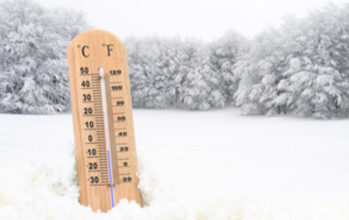 Outdoor thermometer showing freezing temperature in winter