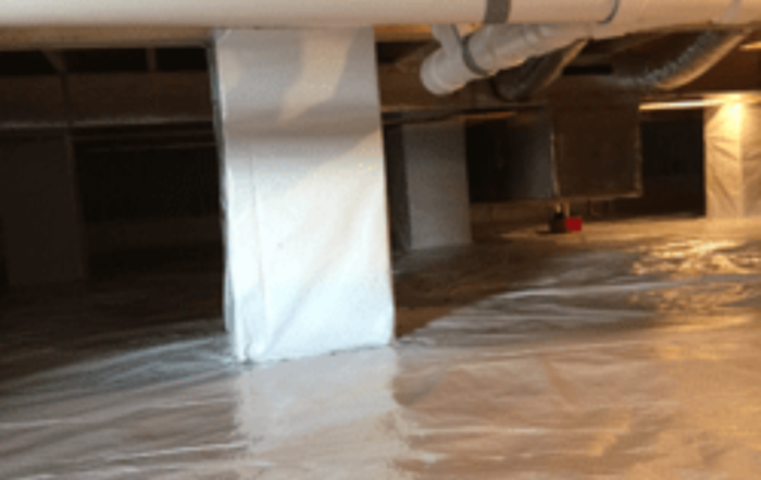 Crawlspace insulation with plastic sheeting in customer's home.