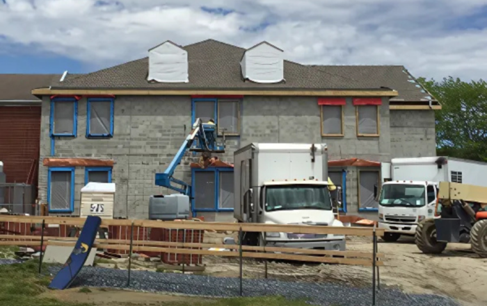 Exterior view of multi-story home under construction