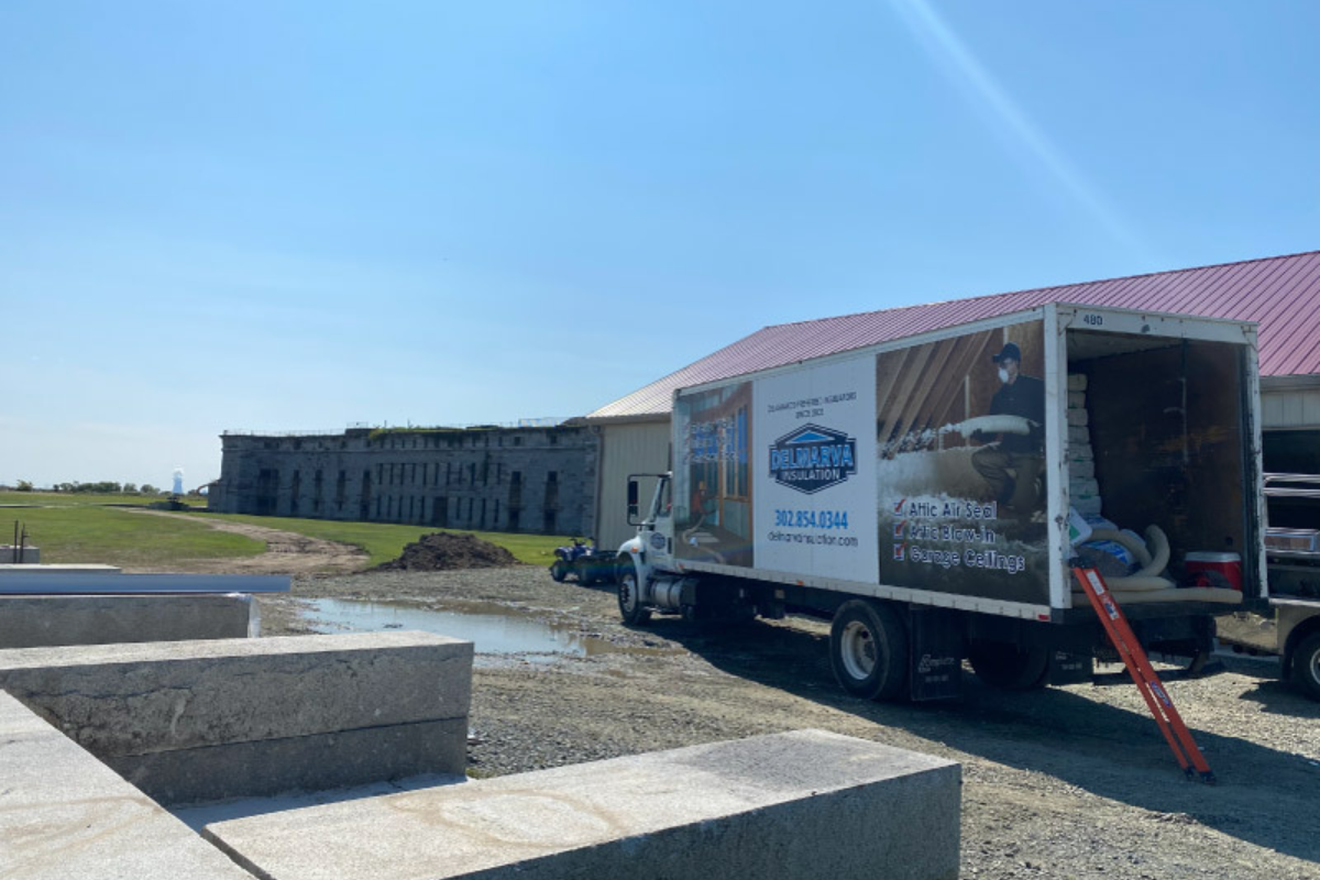 Commercial installation (state owned buildings) on Pea Patch Island. Trucks taken to job on a barge.